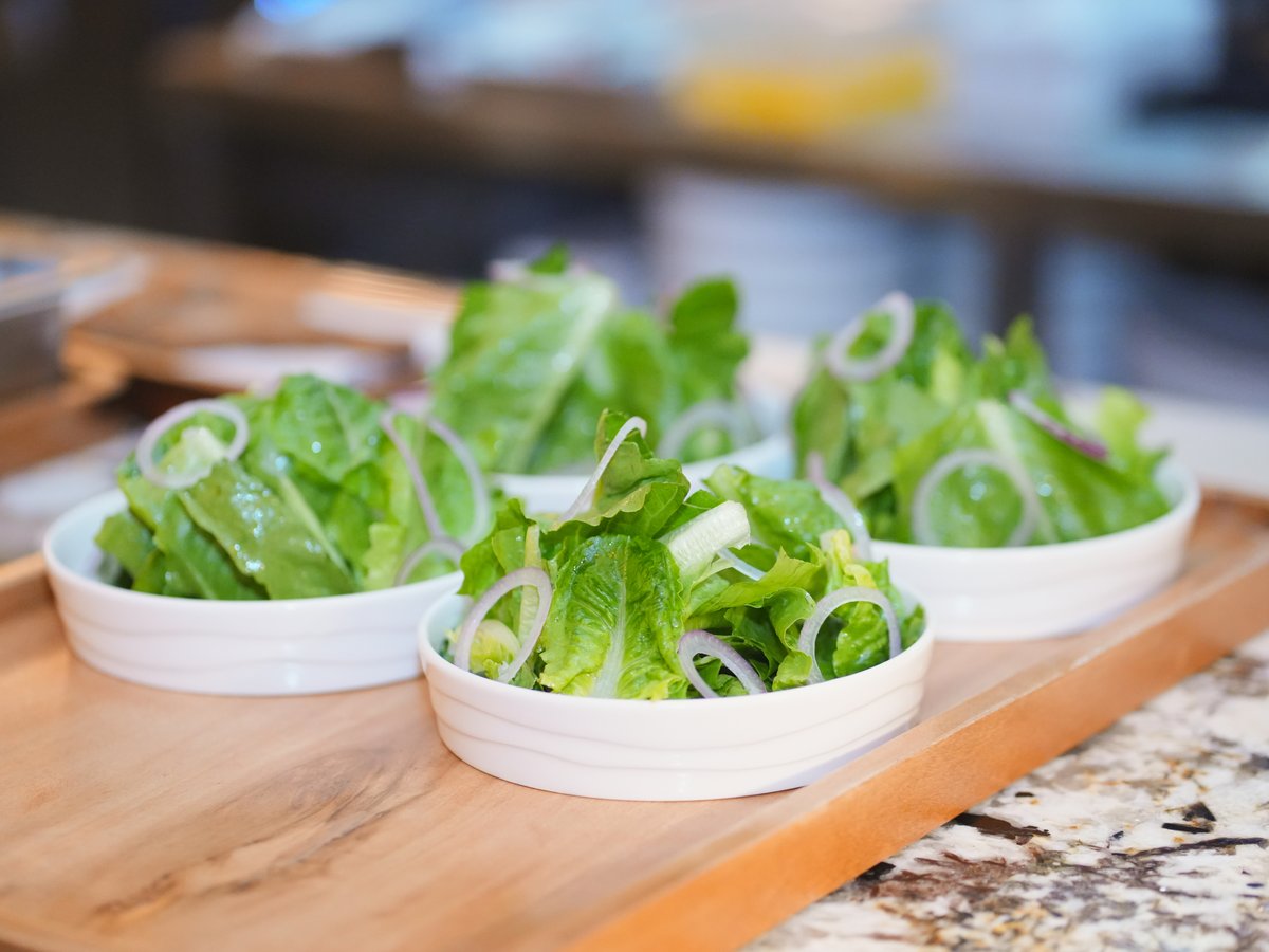 Green salad with onion and Ceres vinegar.